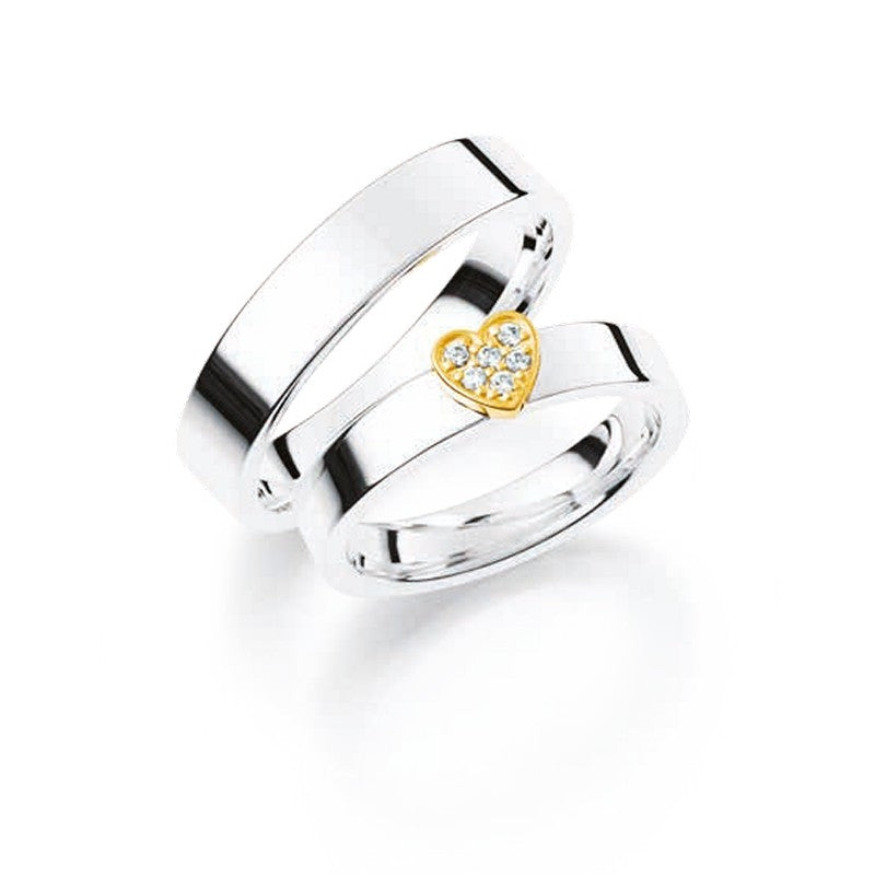 Romantiske Aagaard vielsesringe i sterlingsølv med 14 kt guldhjerte og 0,06 ct diamanter – sæt med feminin og maskulin ring.